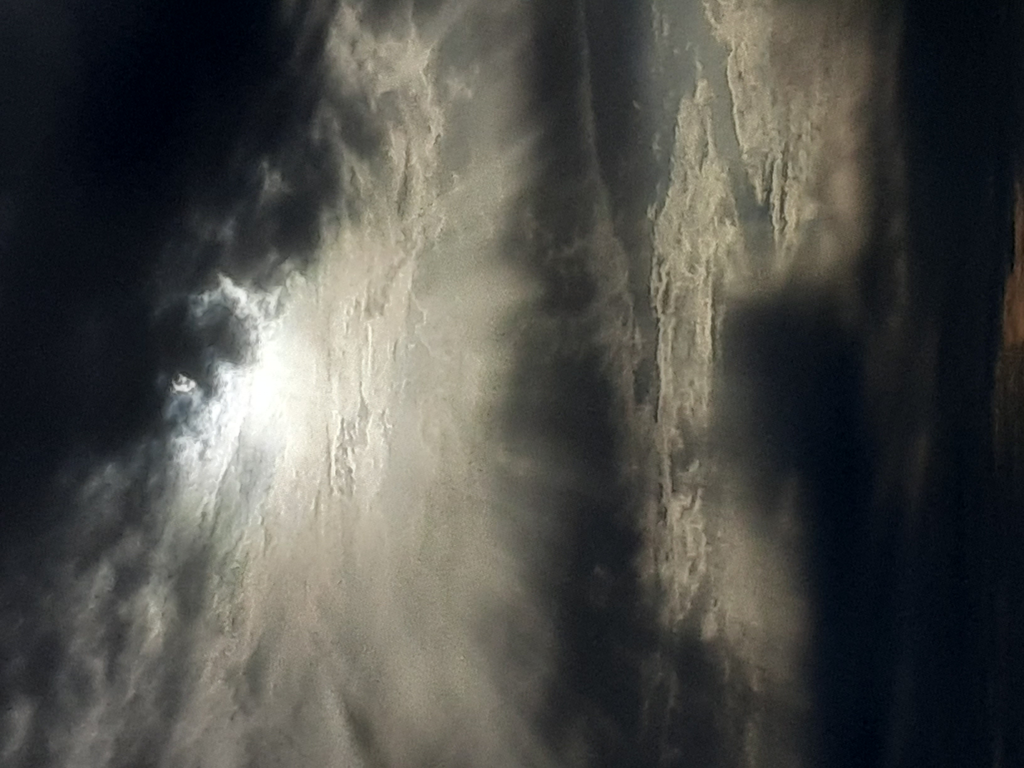 Picture of clouds with sun peaking through